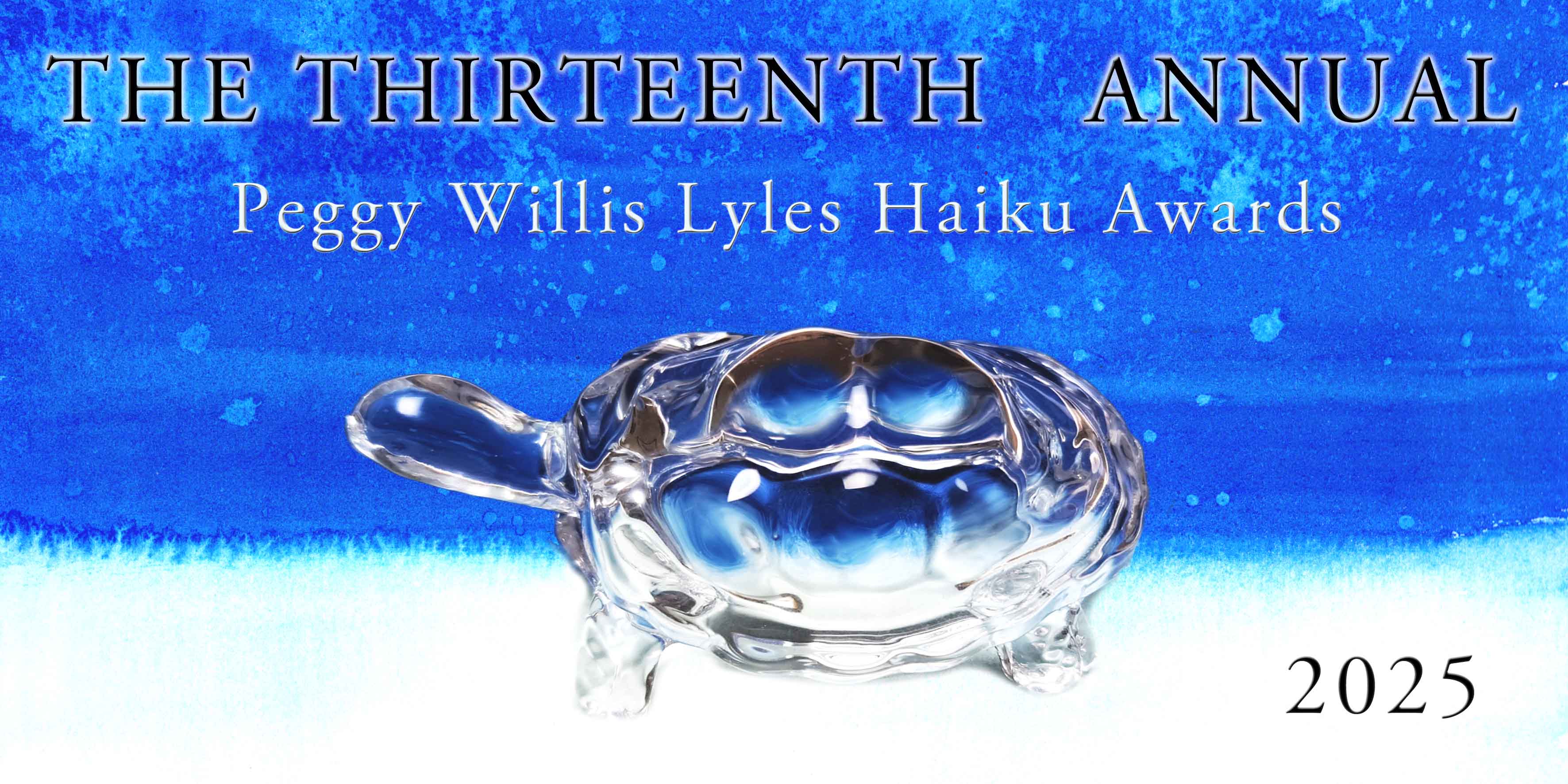 a miniature glass turtle on a blue and white background